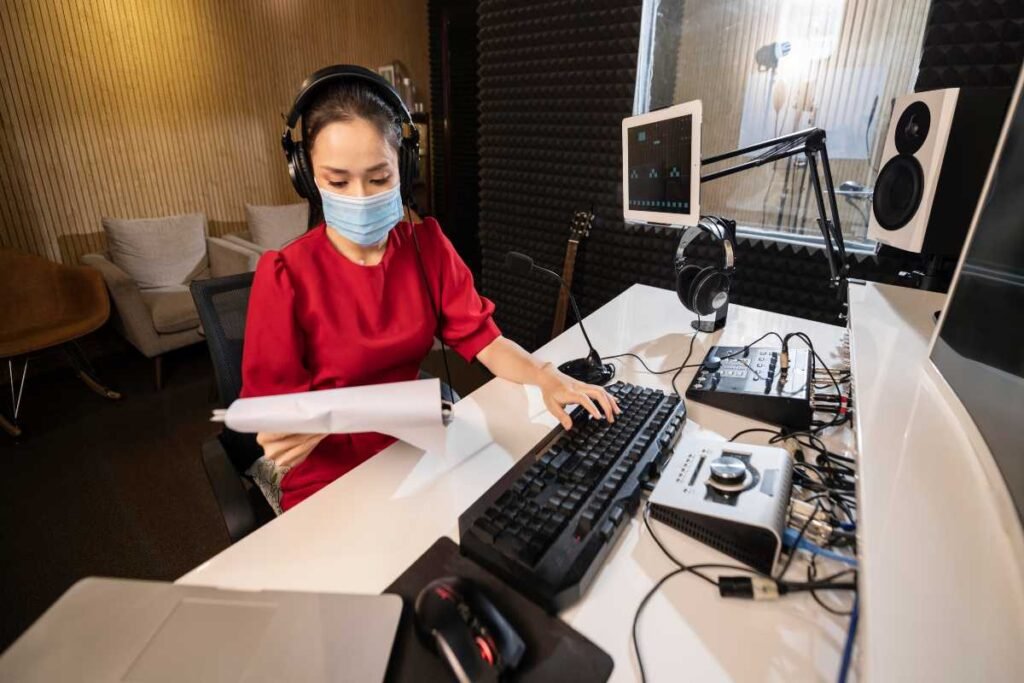 A professional home music studio featuring recording equipment, audio software, studio monitors, and business tools for music production and career growth.